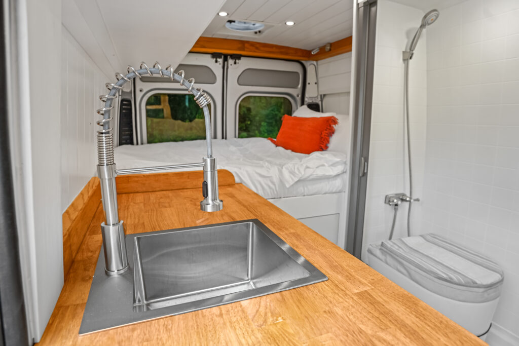 glamp mobile gm2 ram promaster campervan wet bathroom open door